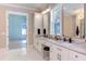 Elegant bathroom with double vanity, marble countertops, and walk in closet at 40 Harvest View Way, Franklinton, NC 27525