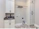 Laundry room with shaker cabinets, granite countertop, and ample storage at 40 Harvest View Way, Franklinton, NC 27525