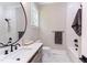 Spa-like bathroom with a large mirror, quartz countertop, and shower/tub combo at 40 Harvest View Way, Franklinton, NC 27525