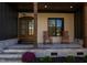 Inviting front porch with rocking chairs and double front doors at 40 Harvest View Way, Franklinton, NC 27525