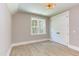Well-lit bedroom with double doors and a large window at 40 Harvest View Way, Franklinton, NC 27525