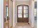 Elegant entryway with double wood doors and a sliding barn door at 40 Harvest View Way, Franklinton, NC 27525