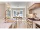 Open kitchen with a farmhouse sink and stainless steel appliances at 40 Harvest View Way, Franklinton, NC 27525