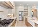 Modern kitchen with stainless steel appliances and marble countertops at 40 Harvest View Way, Franklinton, NC 27525