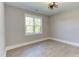 Spacious bedroom with hardwood floors and large window at 40 Harvest View Way, Franklinton, NC 27525