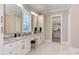 Bathroom boasts double vanity, marble floors and walk-in closet at 40 Harvest View Way, Franklinton, NC 27525