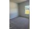 Spacious bedroom with a window offering an outdoor view at 169 Liam Dr, Broadway, NC 27505