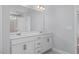 Double vanity bathroom with white cabinets and a large mirror at 69 Fairwinds Dr, Lillington, NC 27546