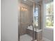 Large walk-in shower with built-in seat and glass enclosure at 61 Fairwinds Dr, Lillington, NC 27546