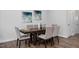 Elegant dining room showcasing a dark wood table and six light gray chairs at 61 Fairwinds Dr, Lillington, NC 27546