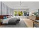 Relaxing main bedroom with large windows, a comfy bed, and plenty of natural light at 1308 Hedgelawn Way, Raleigh, NC 27615