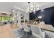 Elegant dining room with a wine display and modern chandelier at 1308 Hedgelawn Way, Raleigh, NC 27615