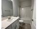 Clean bathroom with a single vanity, tub, and tile flooring at 601 Sweet Potato Lane # 5, Nashville, NC 27856