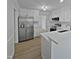 Modern kitchen with stainless steel appliances and white cabinets at 508 Samara St, Apex, NC 27502