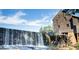 Historic mill with waterfall and water wheel at 1329 Sanctuary Pond Dr, Raleigh, NC 27603