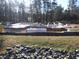 New home construction site with poured foundation and framing in progress at 1329 Sanctuary Pond Dr, Raleigh, NC 27603