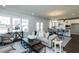 Open living room featuring a comfortable couch and access to the kitchen at 213 Beacon Dr, Pittsboro, NC 27312