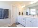 Elegant bathroom with double vanity, large mirror, and tiled shower at 213 Beacon Dr, Pittsboro, NC 27312