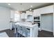 Modern kitchen with white cabinets, stainless steel appliances, and an island at 213 Beacon Dr, Pittsboro, NC 27312