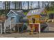 Community playground with two playhouses connected by tunnel at 213 Beacon Dr, Pittsboro, NC 27312