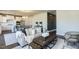 Spacious living room with an open floor plan and adjacent kitchen at 213 Beacon Dr, Pittsboro, NC 27312