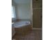 Primary bathroom with corner soaking tub and shower at 511 Normandy St, Cary, NC 27511