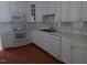 White cabinets, tile floors, and modern appliances at 511 Normandy St, Cary, NC 27511