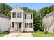Exterior view of 2-story home with white siding at 4425 Woodlawn Dr, Raleigh, NC 27616
