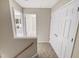 Upstairs hallway with two bedrooms and a linen closet at 4425 Woodlawn Dr, Raleigh, NC 27616