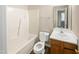 Clean bathroom with a tub, toilet and vanity at 4425 Woodlawn Dr, Raleigh, NC 27616
