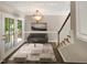 Virtually staged dining room with access to deck and stairs at 4425 Woodlawn Dr, Raleigh, NC 27616