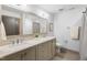 Modern bathroom with double vanity, a large mirror, and a shower/tub combo at 643 Brookview Dr, Chapel Hill, NC 27514