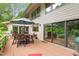 Deck with wooded view, dining area and grill at 643 Brookview Dr, Chapel Hill, NC 27514