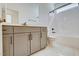 Modern bathroom with gray vanity and white bathtub at 231 Village Walk Dr, Clayton, NC 27527