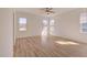 Bright bedroom with hardwood floors and multiple windows at 231 Village Walk Dr, Clayton, NC 27527