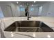 Modern kitchen sink and faucet with white quartz countertop at 154 Swain St, Clayton, NC 27527