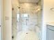 Elegant bathroom with a large walk-in shower and marble tile at 154 Swain St, Clayton, NC 27527