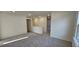 Spacious bedroom with gray carpet and access to hallway and bathroom at 2728 Princess Tree Dr, Raleigh, NC 27616