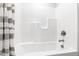 Clean bathroom with a shower/tub combo and gray and white striped shower curtain at 1319 Wiley Rd, Spring Hope, NC 27882