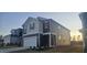 Two-story home with gray and beige siding, a red front door, and landscaping at 2728 Princess Tree Dr, Raleigh, NC 27616