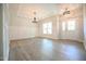 Bright dining room with hardwood floors and elegant chandelier at 196 Abingdon Farms Dr, Selma, NC 27576