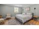 Spacious bedroom with a king-size bed and sitting area at 4937 Carteret Dr, Raleigh, NC 27612