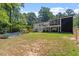 Home exterior view, showcasing backyard, pool, and patio at 4937 Carteret Dr, Raleigh, NC 27612