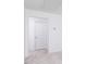 Simple bedroom with a white door and grey carpet at 81 Hank Way, Angier, NC 27501