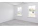 Spacious bedroom with two windows and carpet at 81 Hank Way, Angier, NC 27501