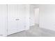 Bright bedroom with double doors and plush carpeting at 81 Hank Way, Angier, NC 27501
