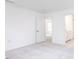 Bright bedroom with carpet and access to additional rooms at 81 Hank Way, Angier, NC 27501