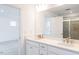 Double vanity bathroom with a large mirror and shower at 81 Hank Way, Angier, NC 27501