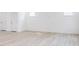 Spacious basement with light grey vinyl flooring at 81 Hank Way, Angier, NC 27501