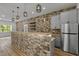 Basement bar with gray cabinets and a built-in beverage tap at 5121 Watkinsdale Ave, Raleigh, NC 27613